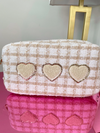 Picture of large make-up bag in a beige and white plaid tweed fabric with 3 heart shaped chenille patches
