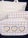 Picture of large make-up bag in a beige and white plaid tweed fabric with 3 heart shaped chenille patches