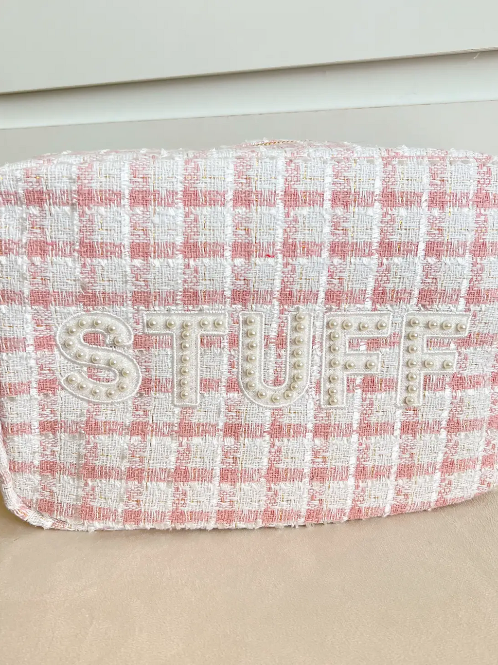Pink and white tweed zippered make-up bag with pearl embellished letters spelling out STUFF