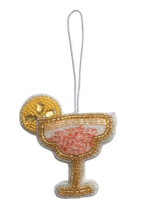 Beaded cocktail glass ornament on a white background